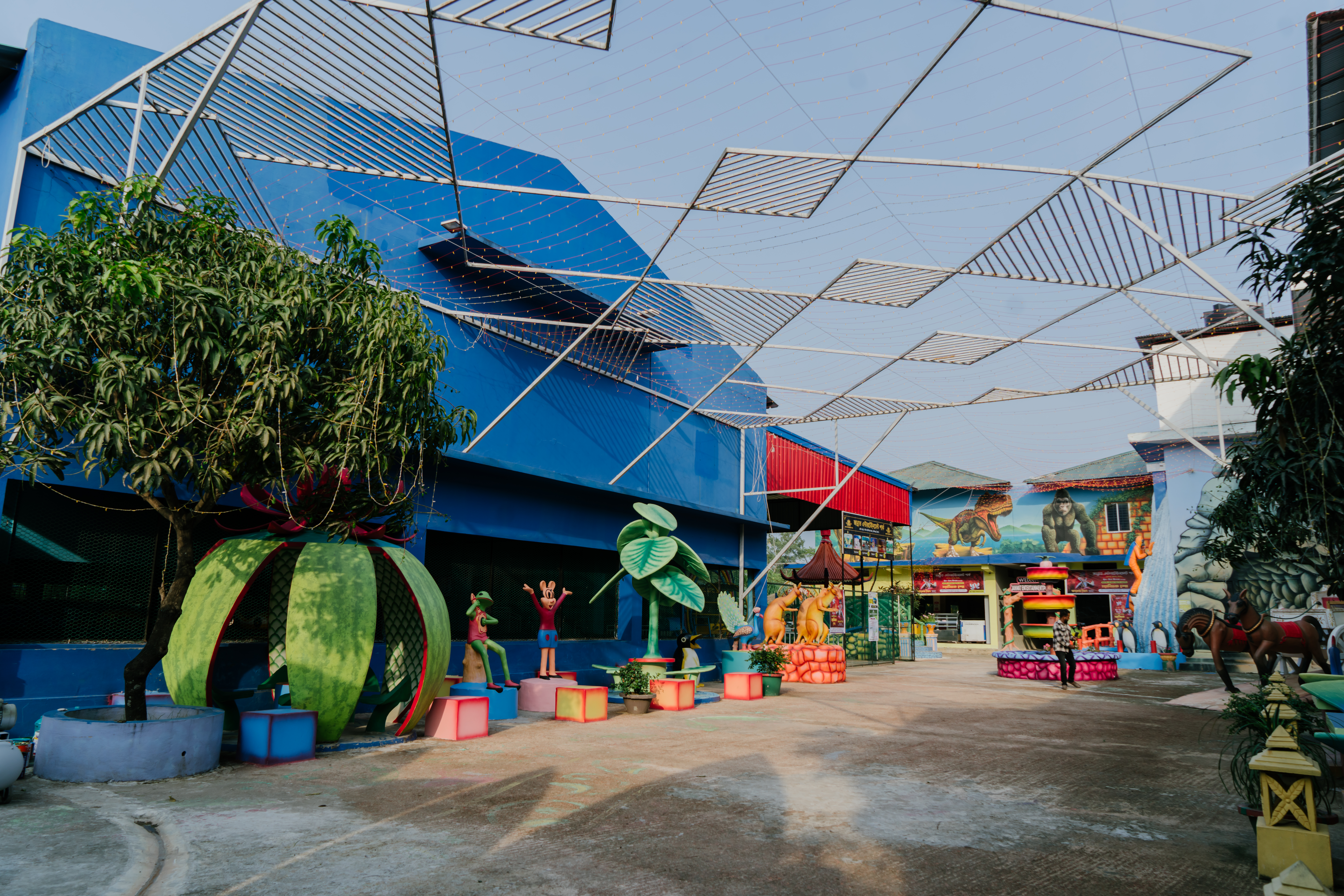Outdoor walkway and greenery at Jannat Entertainment Park